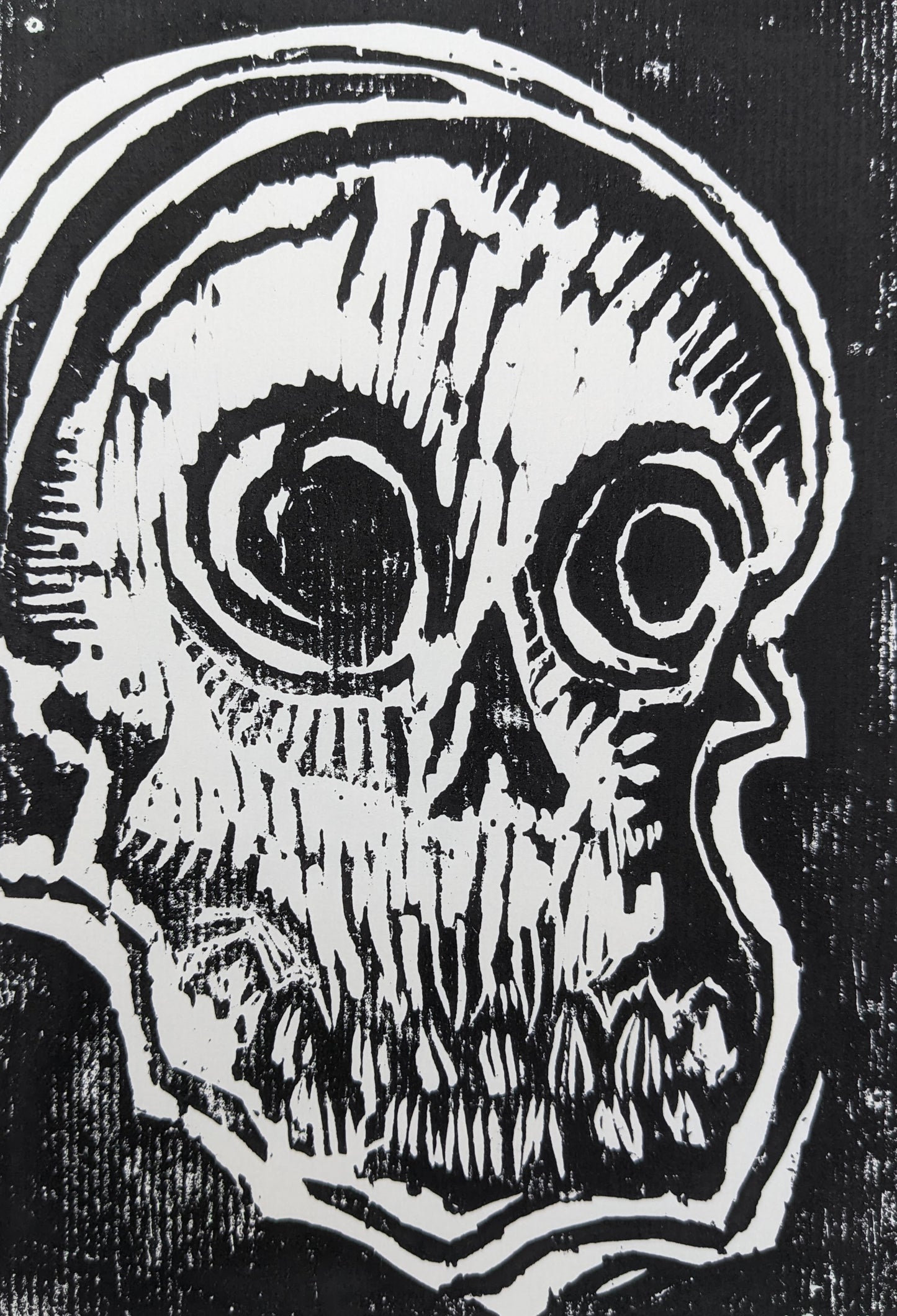 Right facing skull -Untitled Linocut